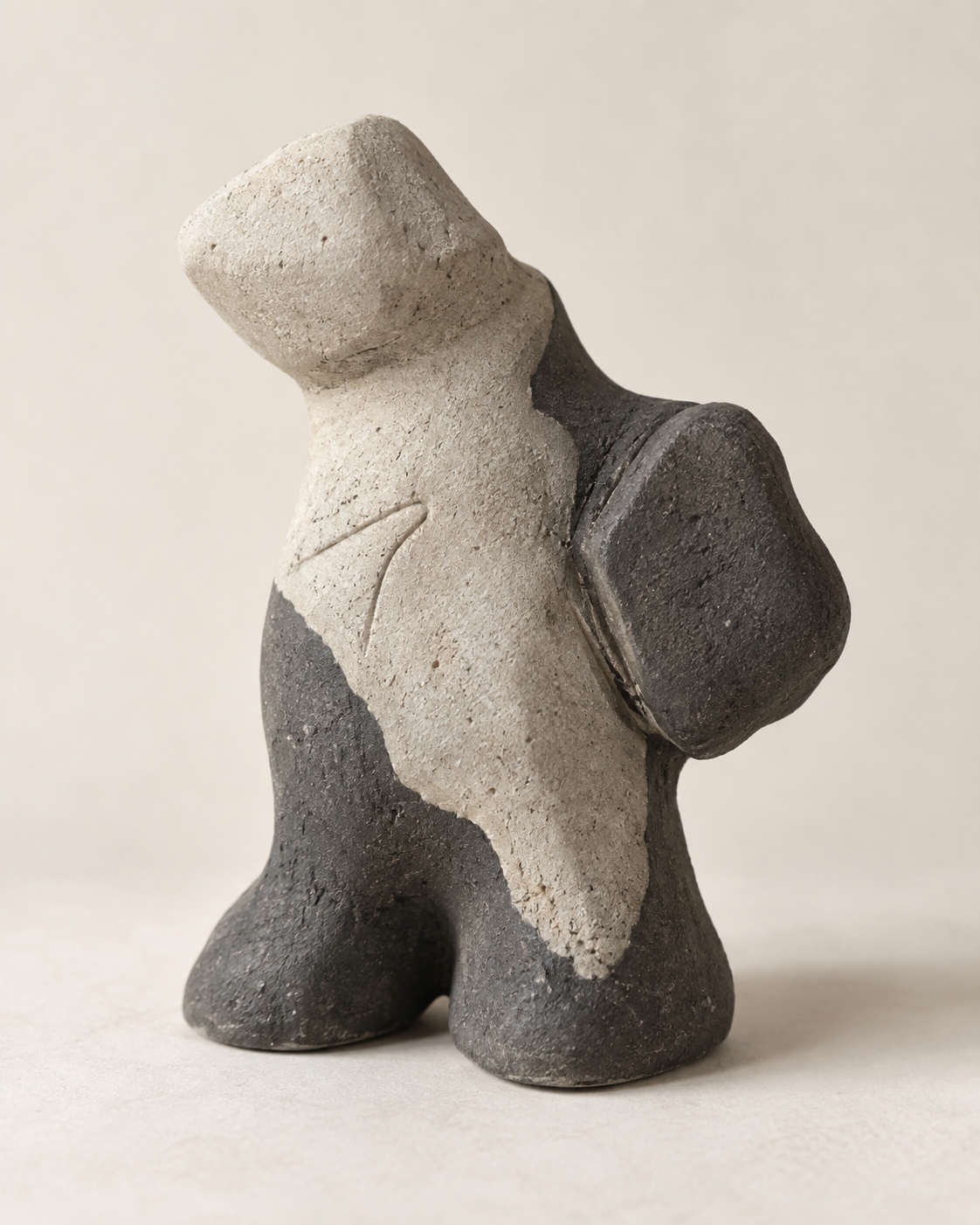 Layered Memory, charcoal and pale-grey cement concept